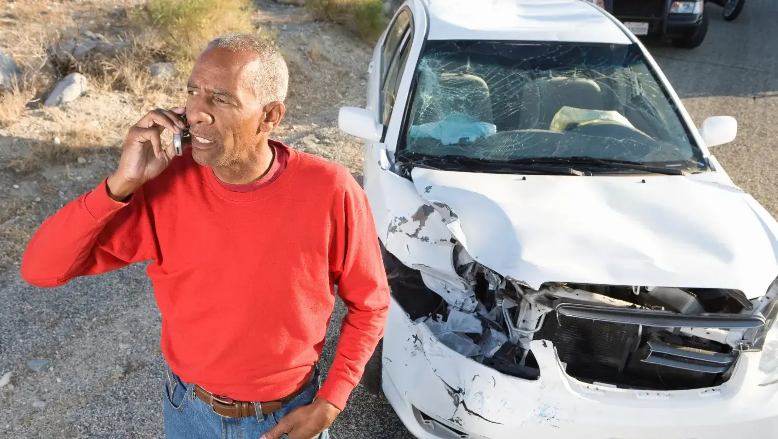 A car accident lawyer discussing a case with a client in an office setting.